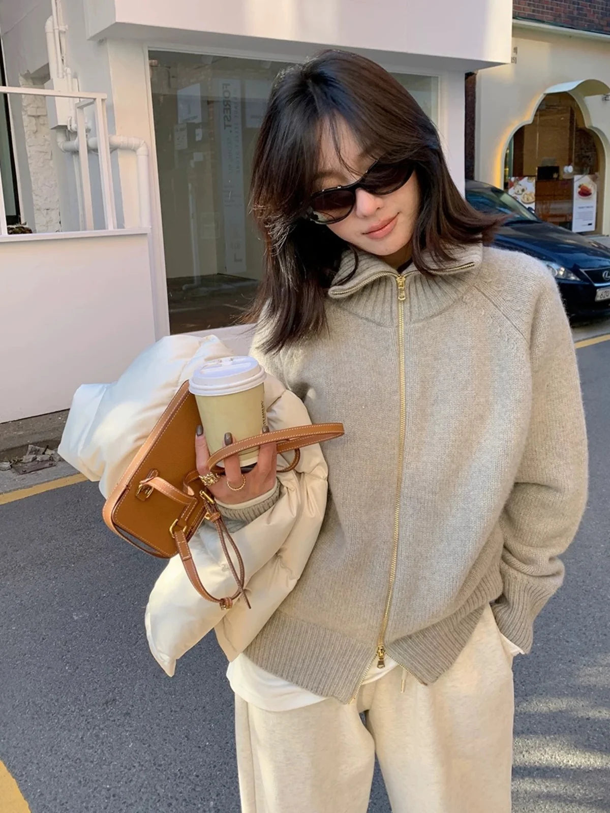 Autumn and winter new zipper cashmere sweater women cardigan lapel sweater coat lazy wind loose.
